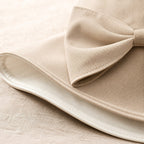 Close-up of beige bow sun hat fabric and stitching